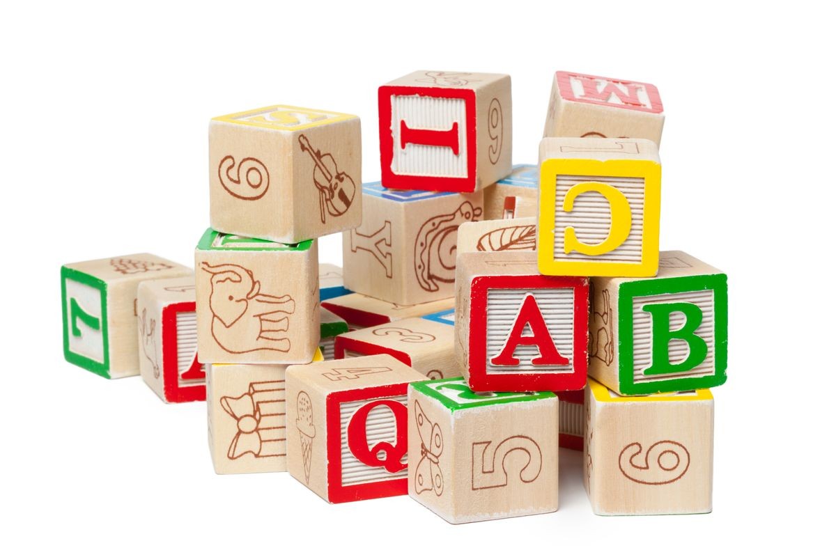 Wooden alphabet blocks isolated on white background